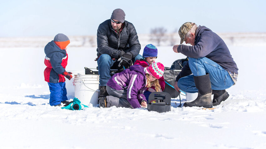 Family Ice Fishing On Late Winter Day16x9 850x478